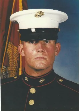 Chris Lee as a young Marine in dress blues